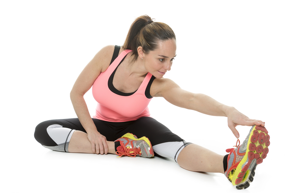 Woman stretches legs before activity