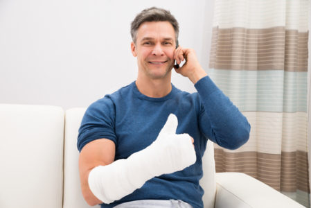 injured man thumbs up