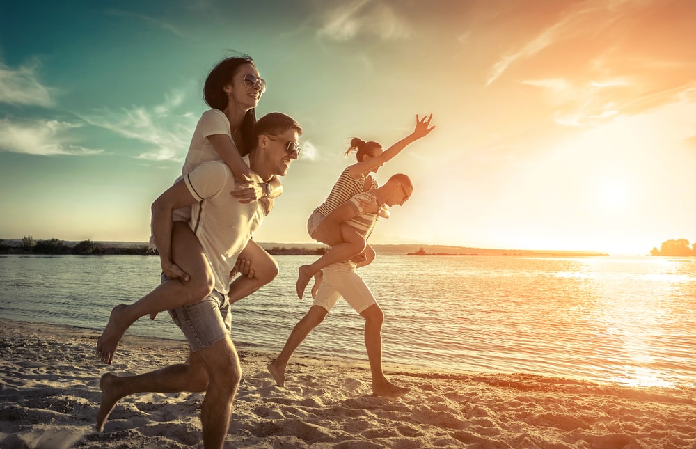 family on the beach in the sun