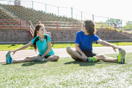 children stretching before running