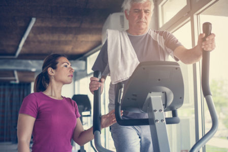 older man recovering with personal trainer