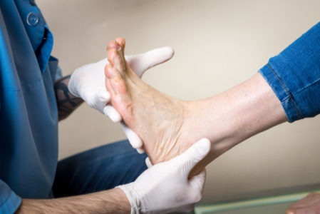 orthopedist looking at foot