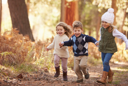 children running in the forest